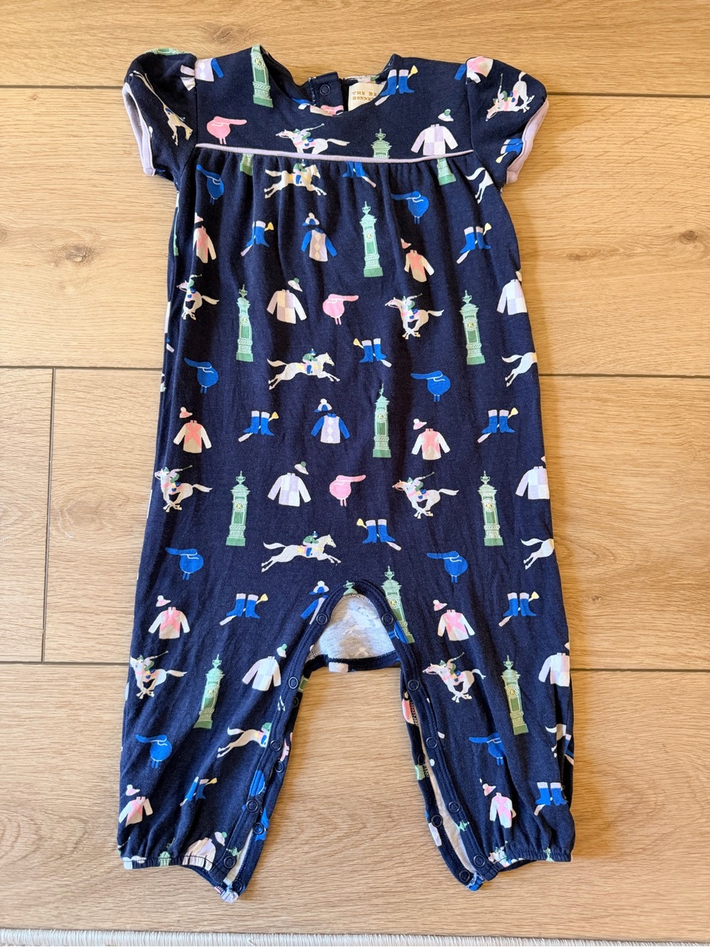 The Beaufort Bonnet Company Navy Short-Sleeve One-Piece with Pastel Jockey Print